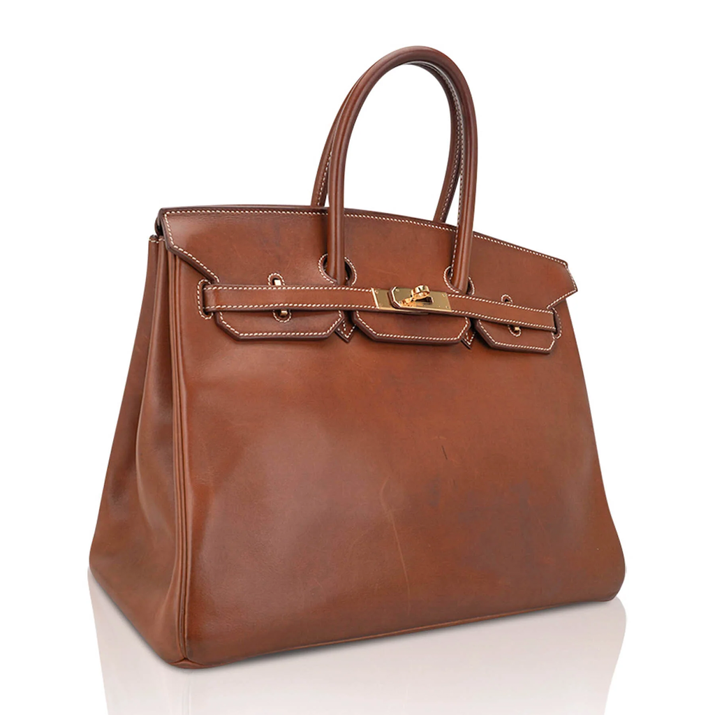 Warm Sunbaked Tan Organic Tonal Generous Sized Structured Hand Tote With Pale Contrast Stitching, Luminous Golden Twist Lock Hardware And Coordinating Tan Suspended Metal Padlock Charm
