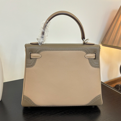 Soft Pale Beige Muted Taupe Two-Tone Compact Trapezoid Hand Tote With Perforated Stitched Trim And Sleek Silvery Twist Lock Hardware